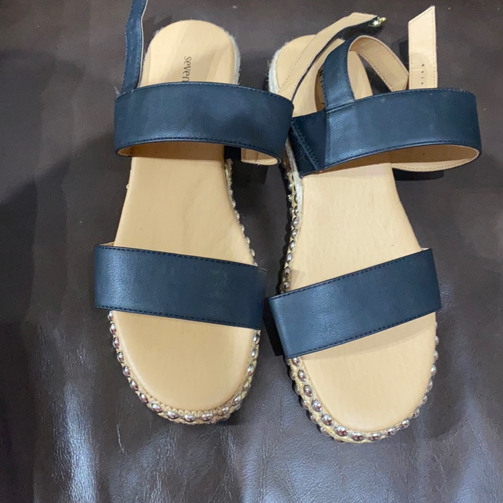 Black sandal never worn but not in it’s original box.